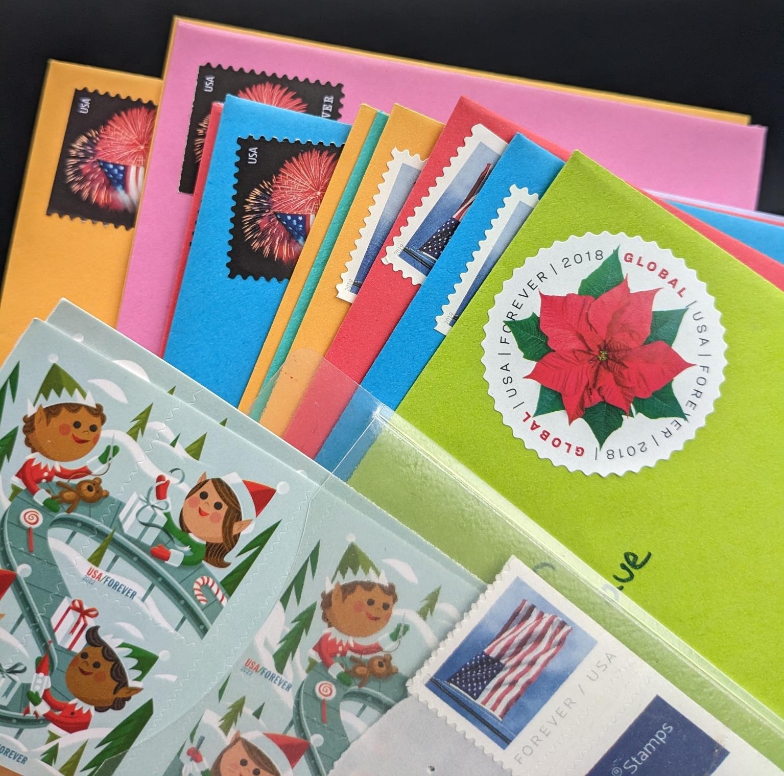 several colorful letters with stamps